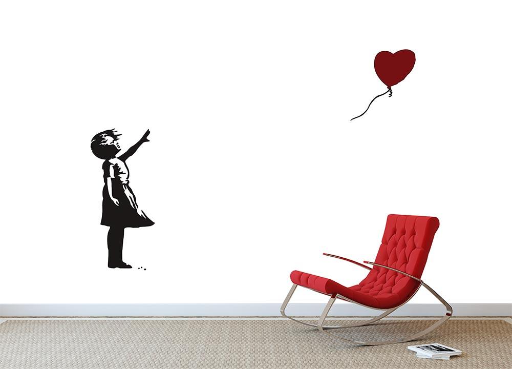 Banksy wall mural wallpaper used as a bold feature wall idea