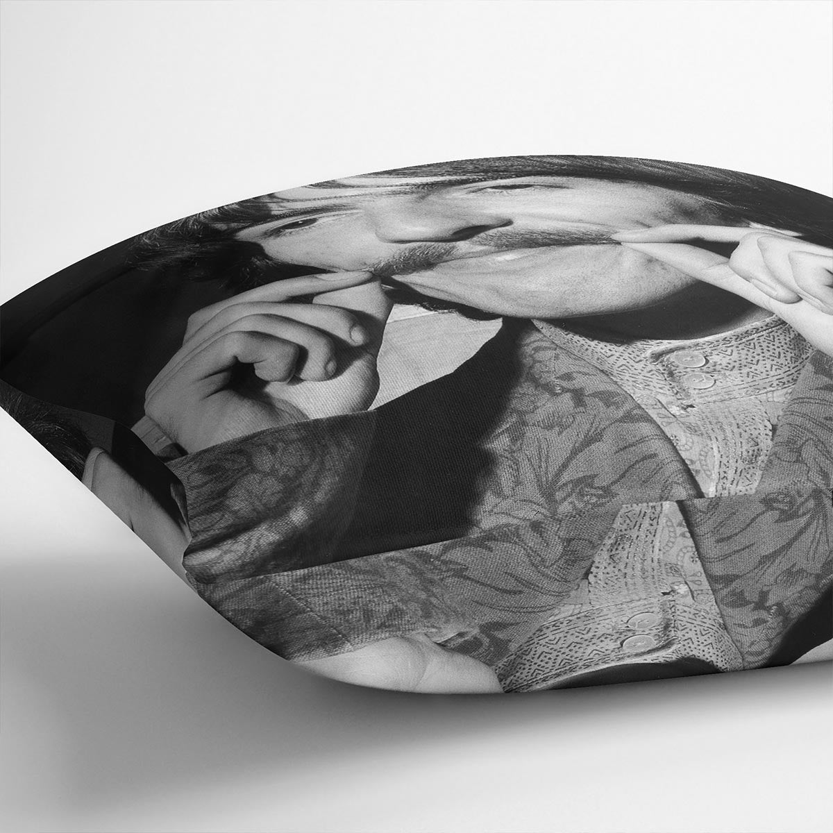 George Harrison plays with his moustache Cushion