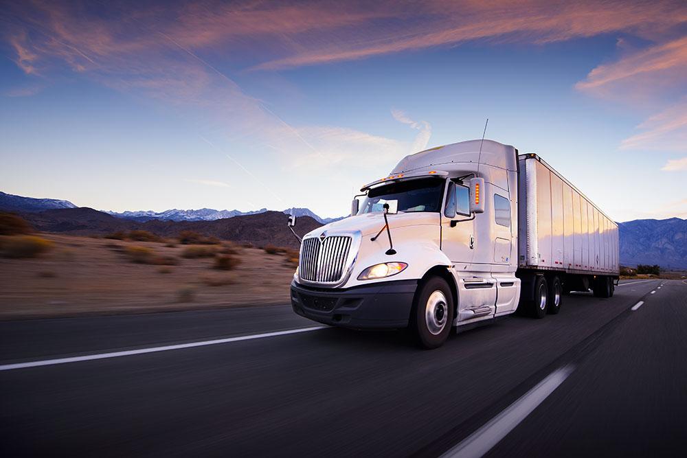Truck and highway at sunset Wall Mural Wallpaper - Canvas Art Rocks - 1