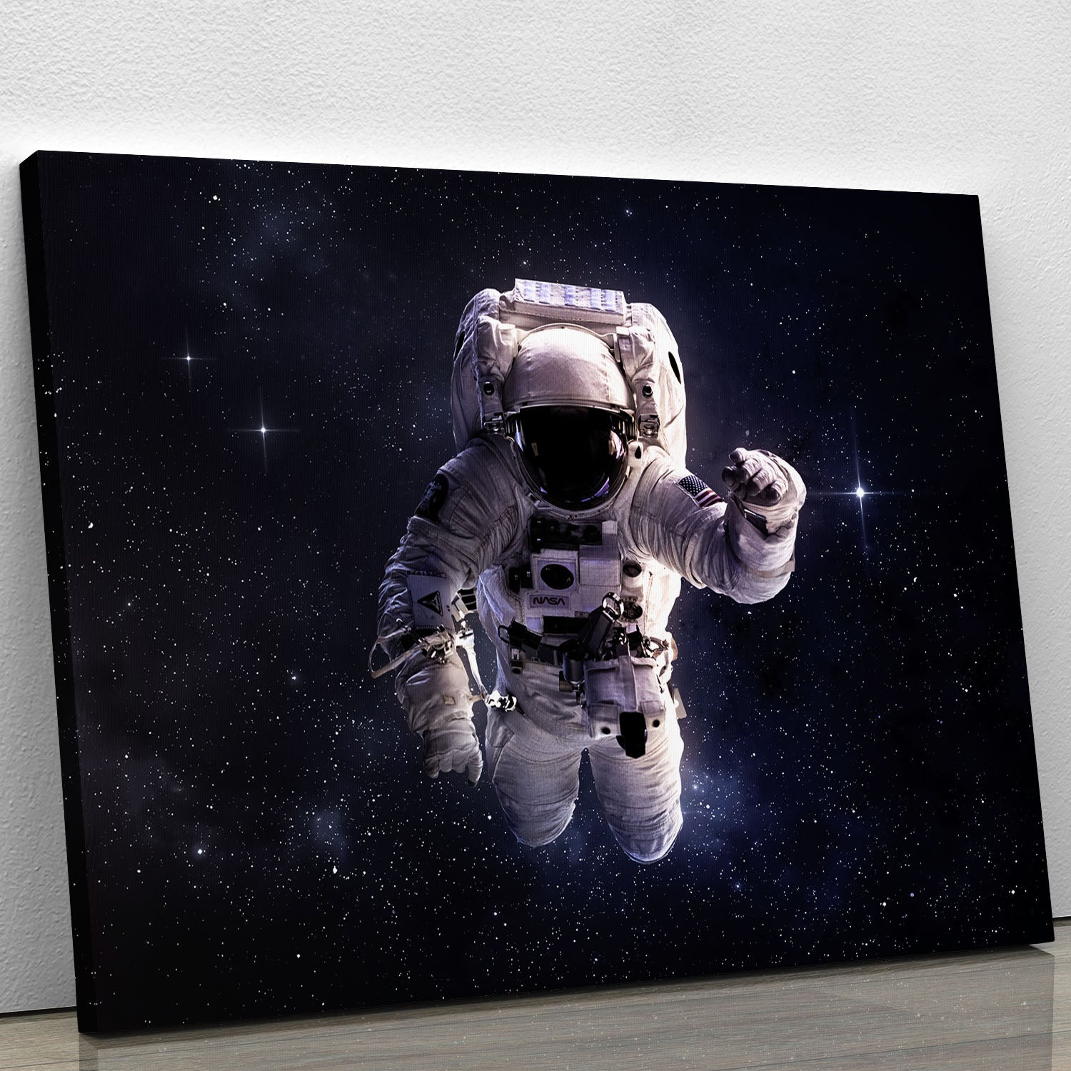 Astronaut in outer space with stars canvas print for space wall art