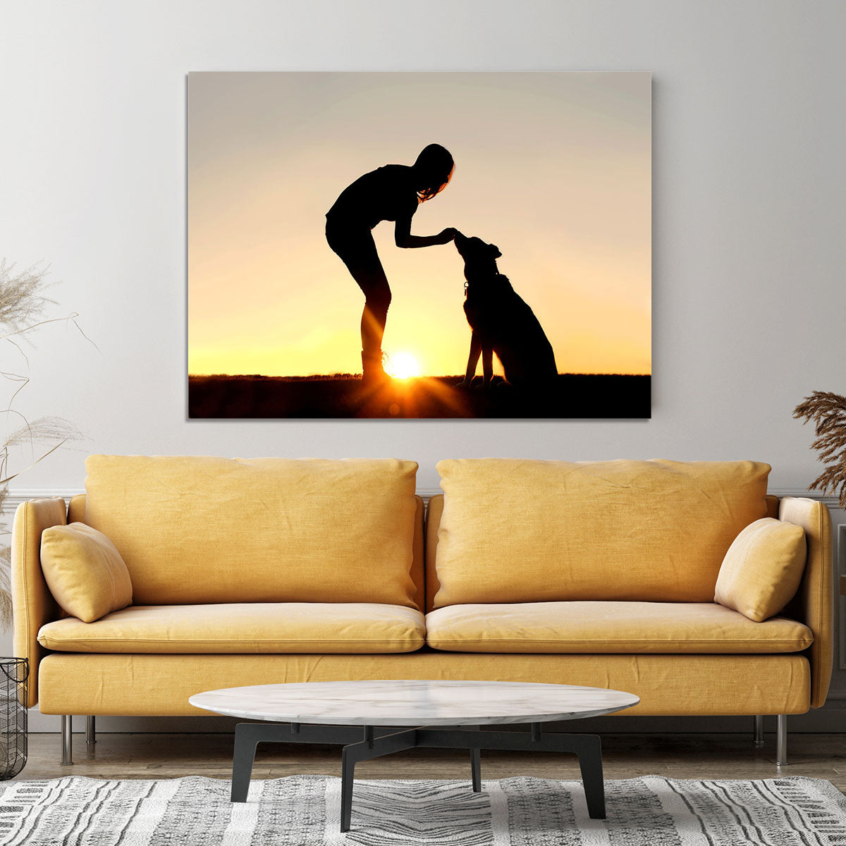 A silhouette of a girl sitting outside in the grass with her pet German Shepherd Mix Dog feeding him treats during training in front of a sunsetting sky. Canvas Print or Poster - Canvas Art Rocks - 4