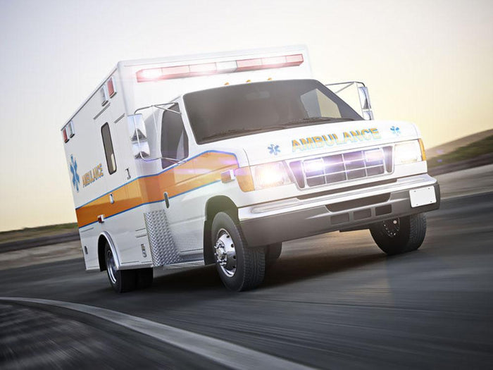 Ambulance running with lights and sirens Wall Mural Wallpaper