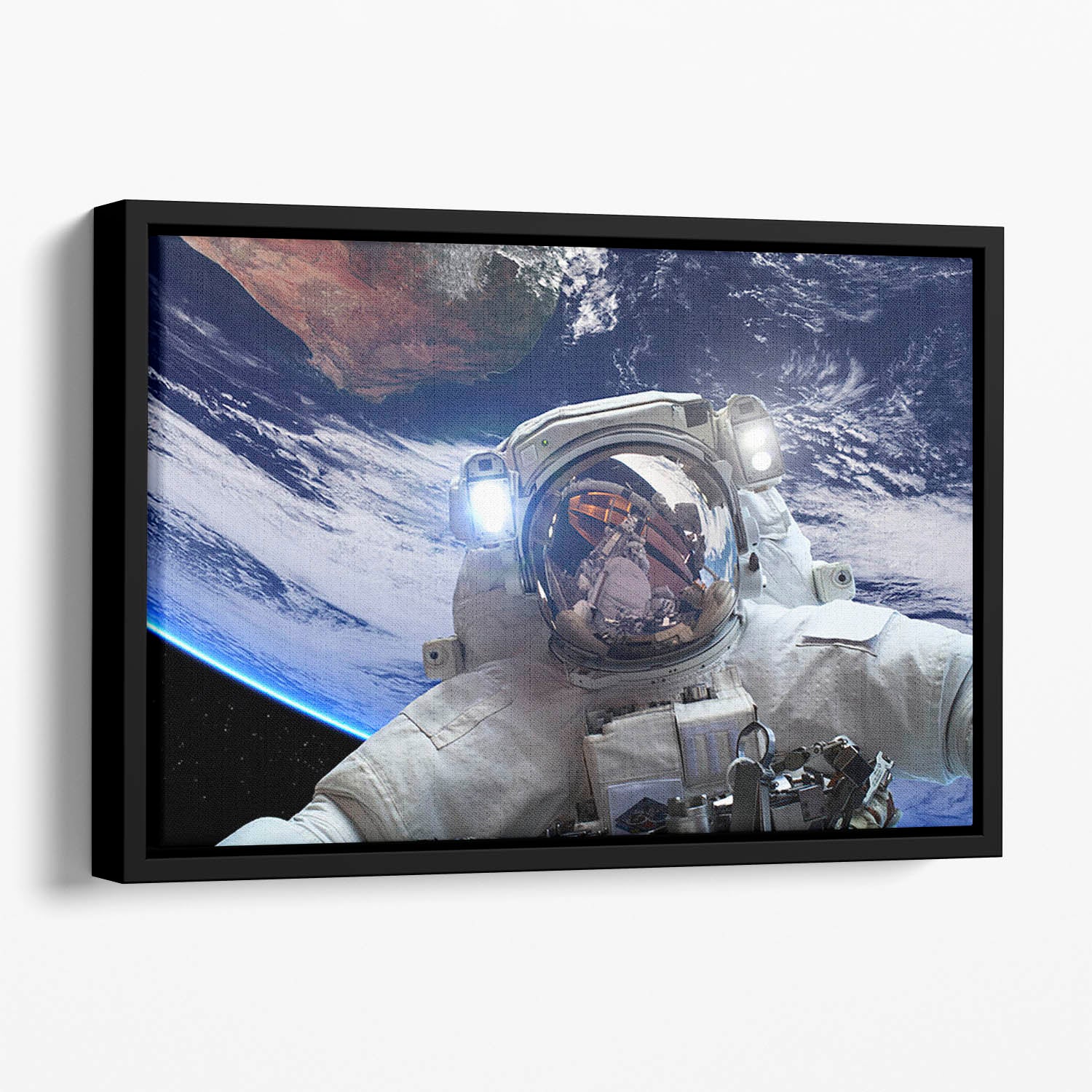 Astronaut in outer space against the backdrop Floating Framed Canvas
