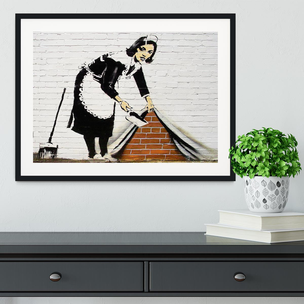 Banksy Maid Sweeping Under the Carpet Framed Print