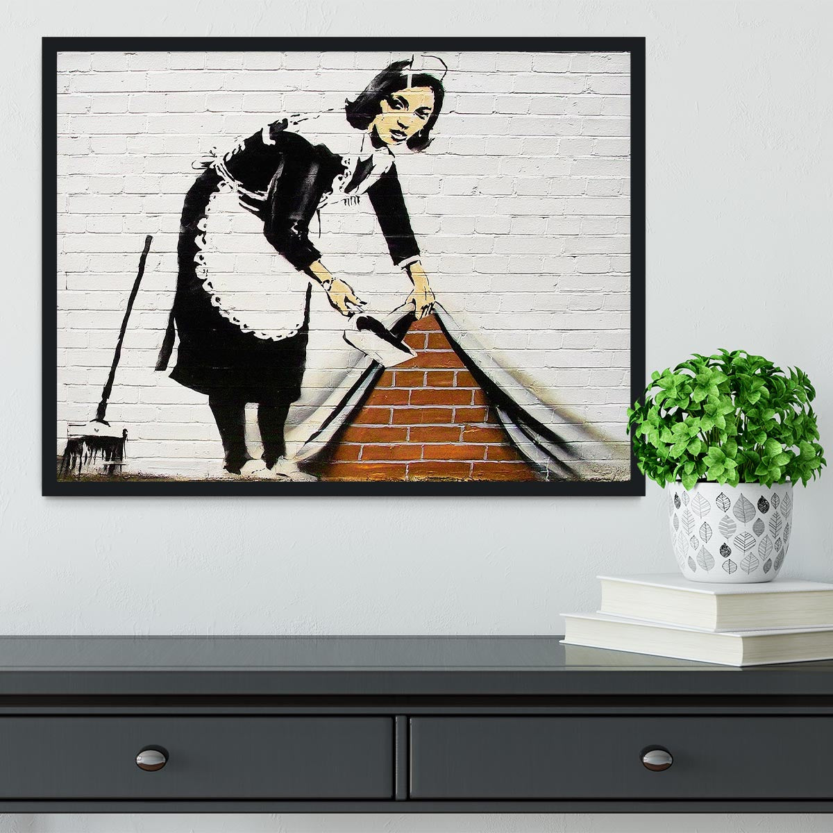 Banksy Maid Sweeping Under the Carpet Framed Print