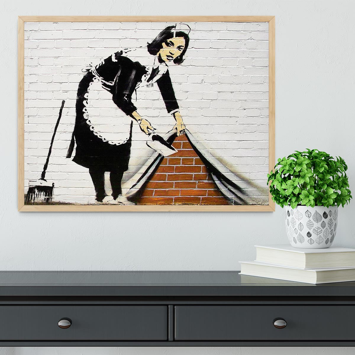 Banksy Maid Sweeping Under the Carpet Framed Print