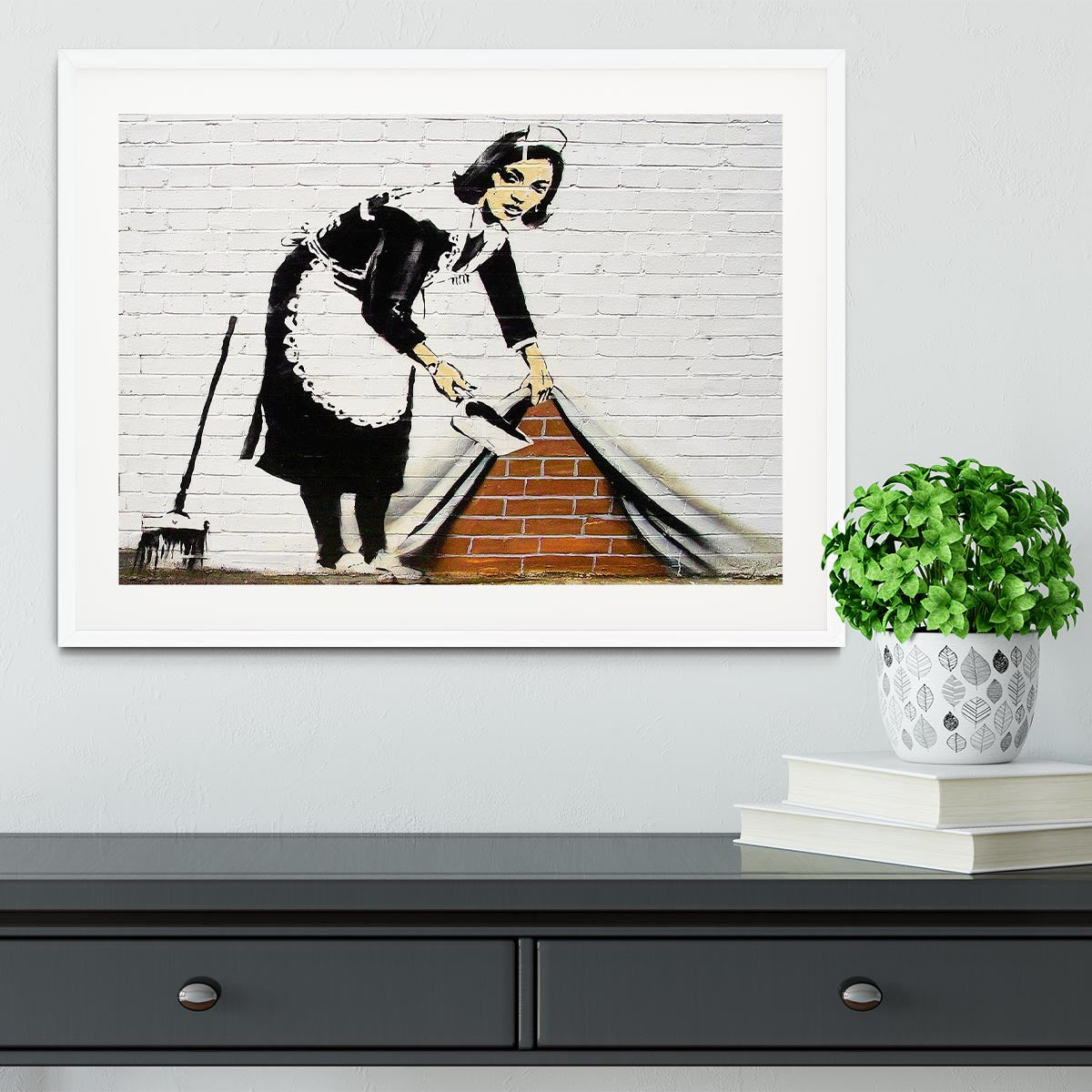 Banksy Maid Sweeping Under the Carpet Framed Print