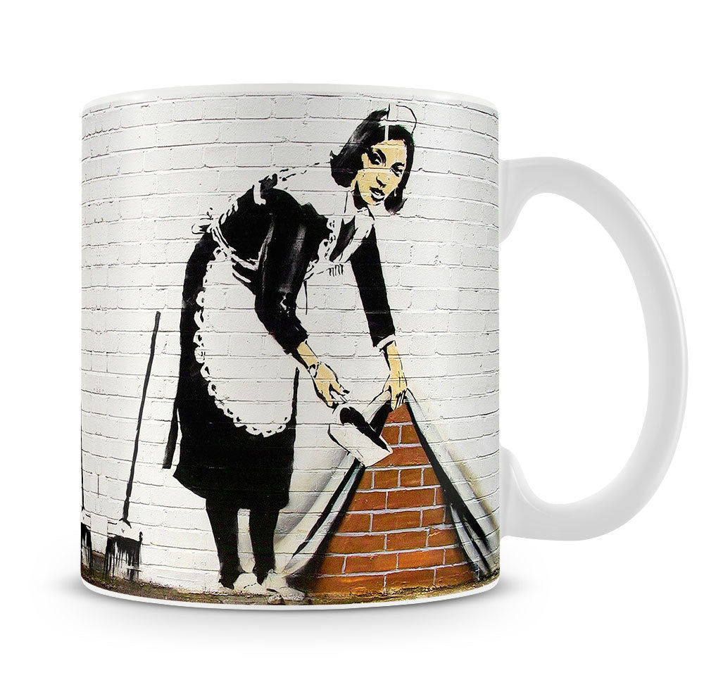 Banksy Maid Sweeping Under the Carpet Mug - Canvas Art Rocks