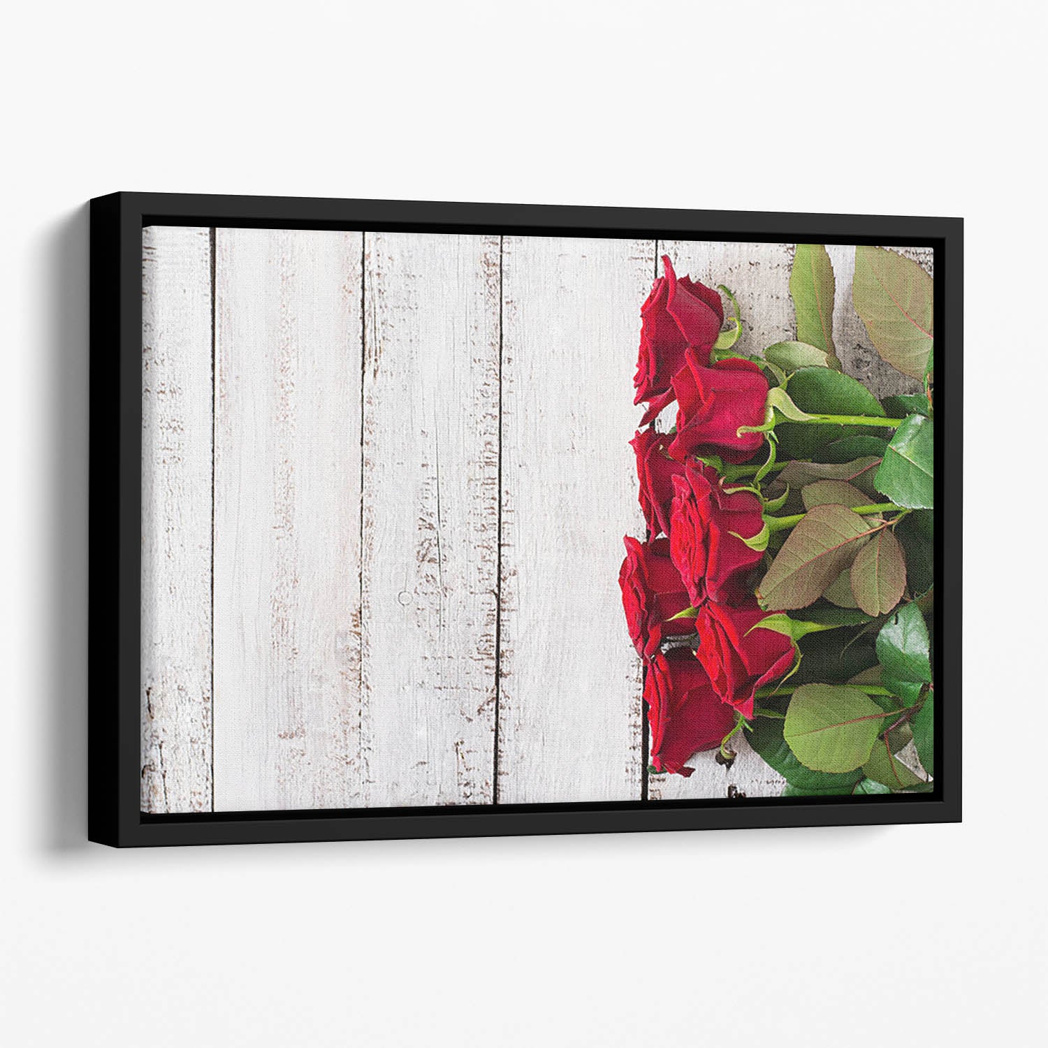 Bouquet of red roses on a light wooden background Floating Framed Canvas