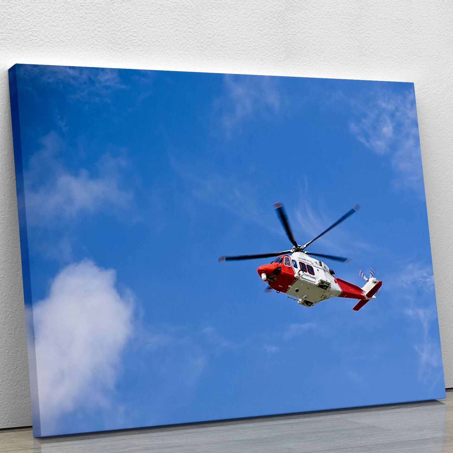 Coastguard helicopter in the blue sky Canvas Print or Poster - Canvas Art Rocks - 1