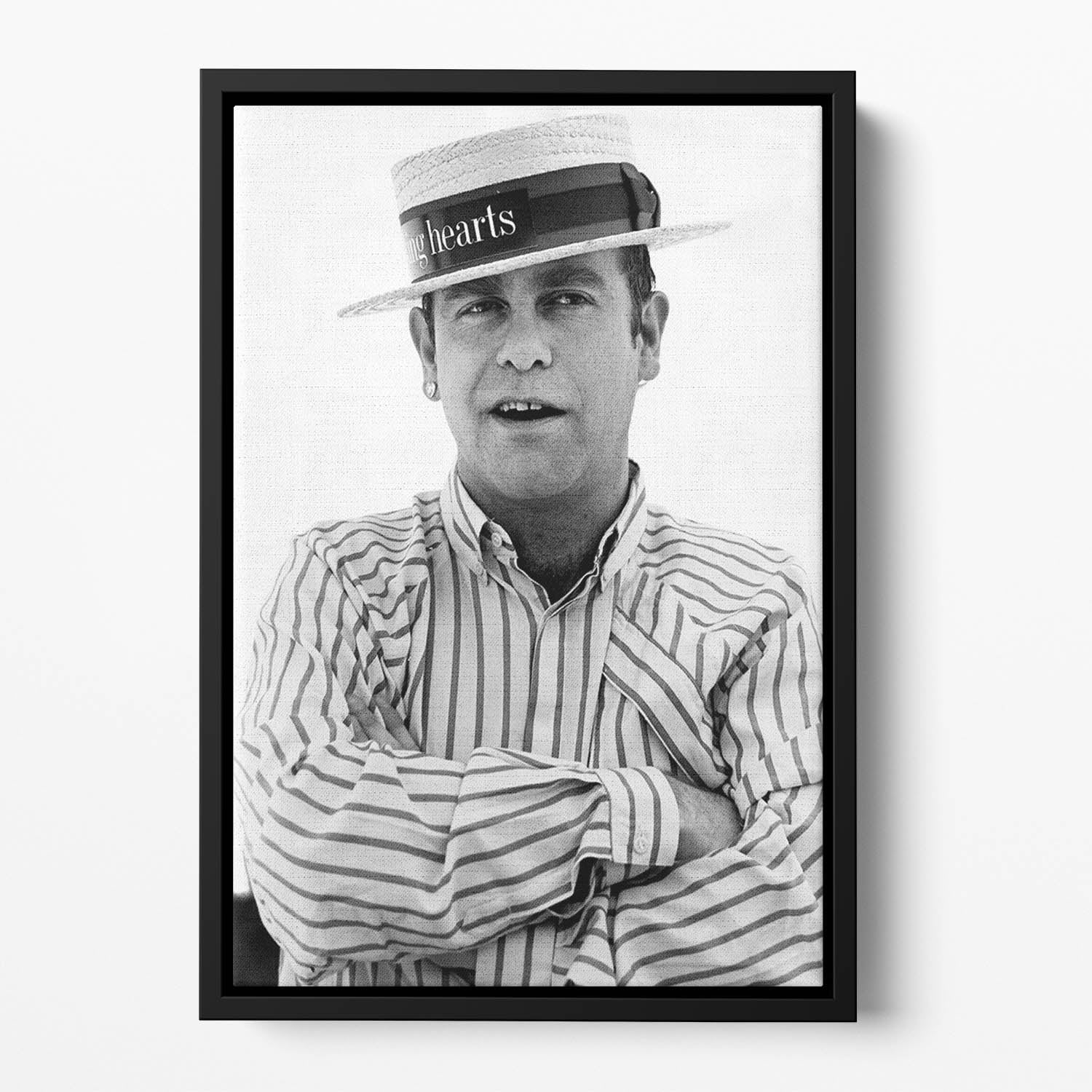 Elton John wearing a straw boater Floating Framed Canvas