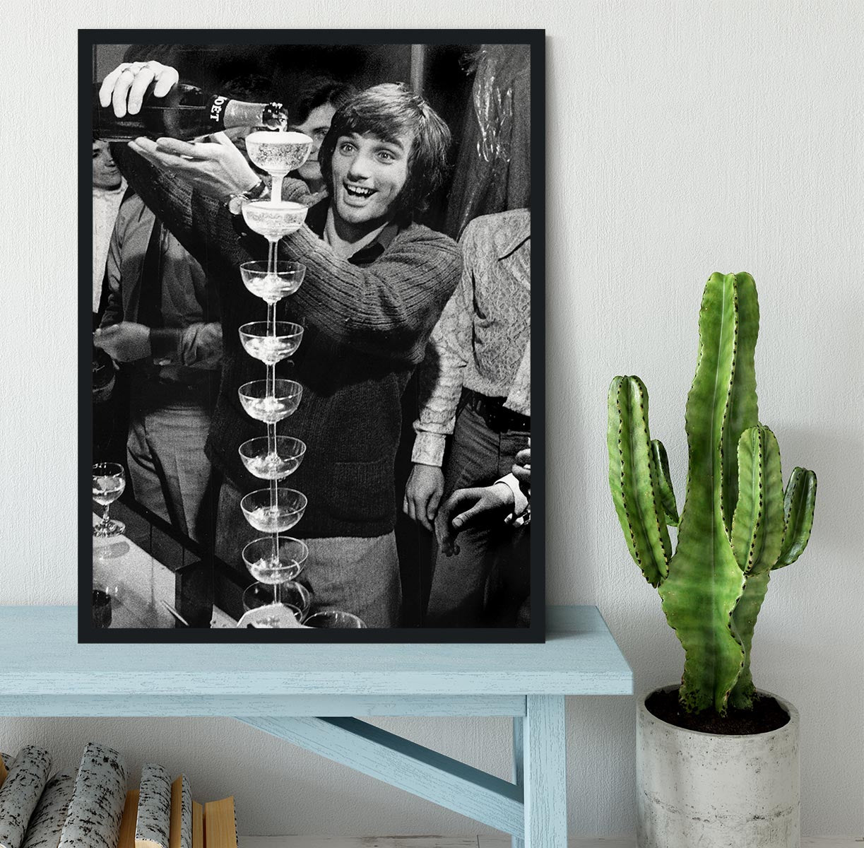 George Best pouring champagne Framed Print - Canvas Art Rocks - 2
