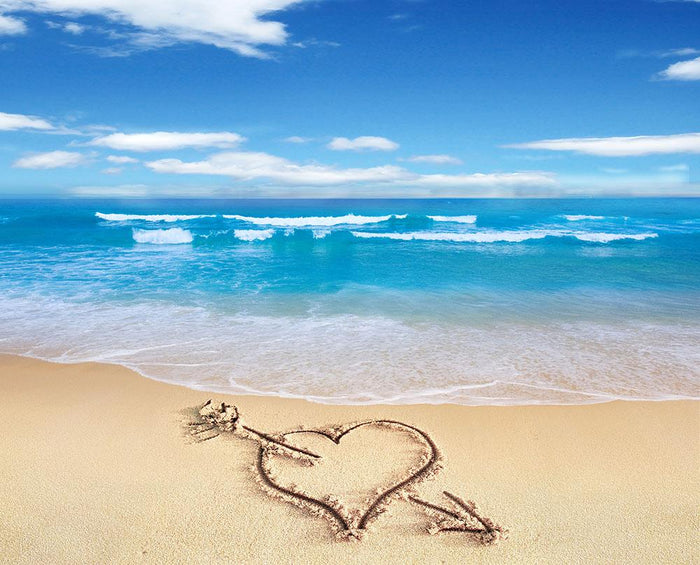Heart with arrow in sand Wall Mural Wallpaper
