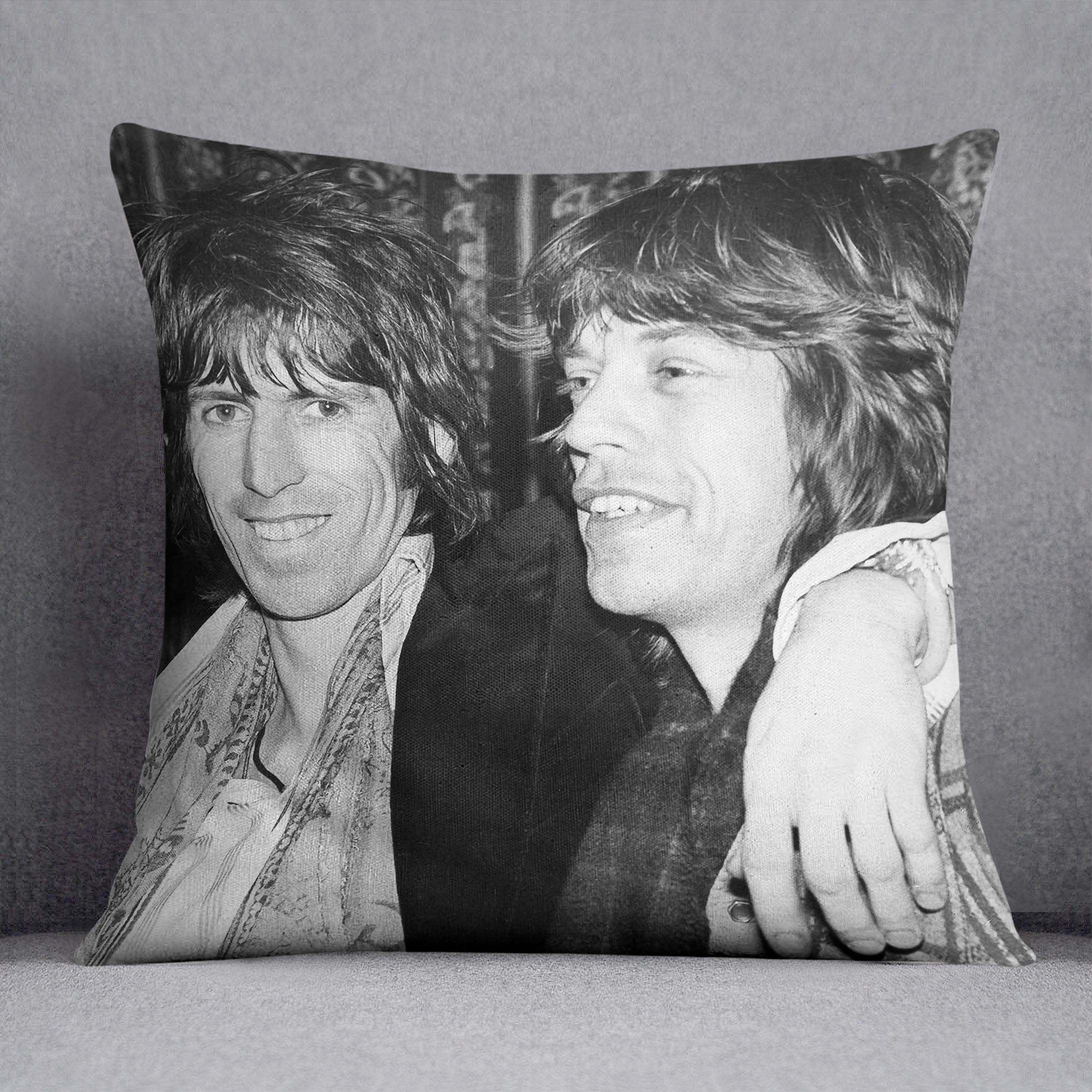 Keith Richards and Mick Jagger celebrate Cushion