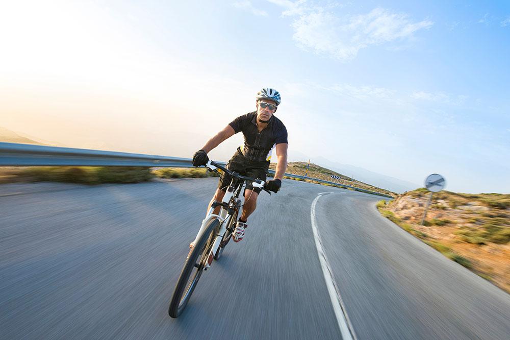 Man riding mountain bike sunny day Wall Mural Wallpaper - Canvas Art Rocks - 1