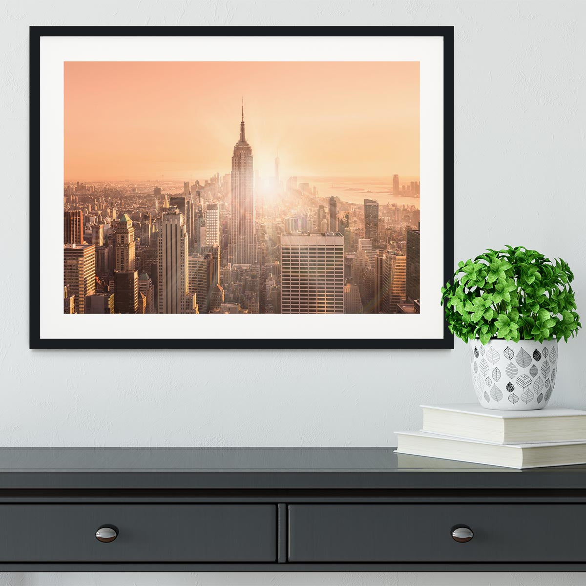 Manhattan downtown skyline with illuminated Empire State Building Framed Print - Canvas Art Rocks - 1