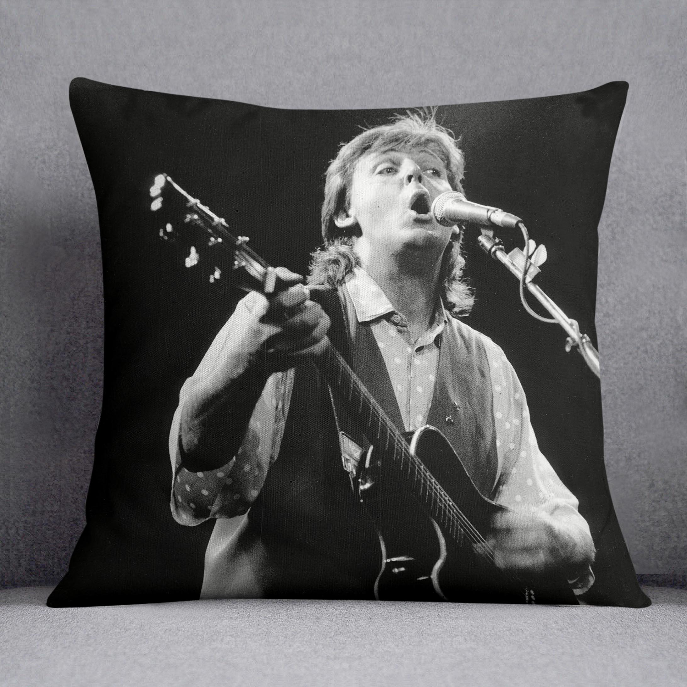Paul McCartney on stage in 1989 Cushion