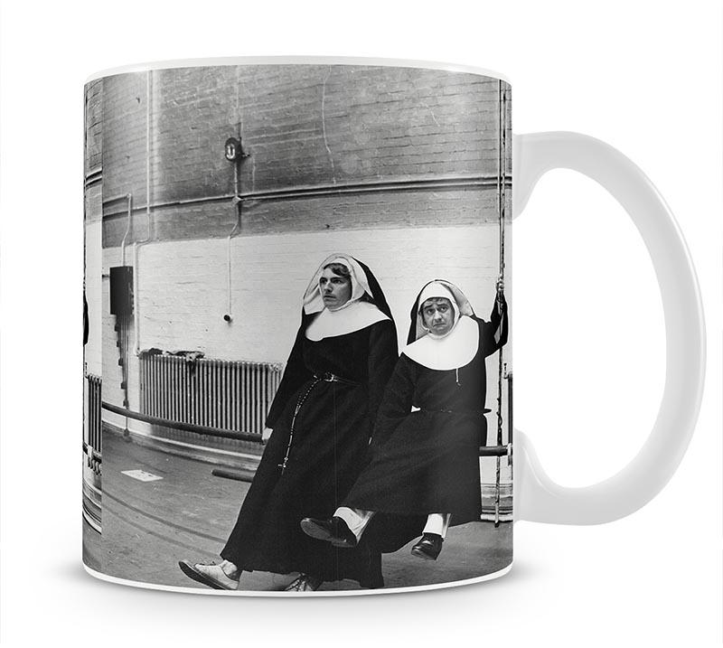 Peter Cook and Dudley Moore dressed as nuns Mug - Canvas Art Rocks - 1
