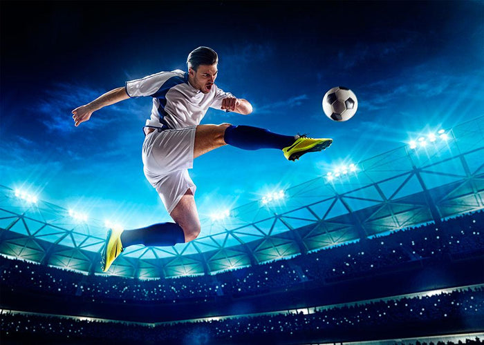 Player in action on night stadium Wall Mural Wallpaper