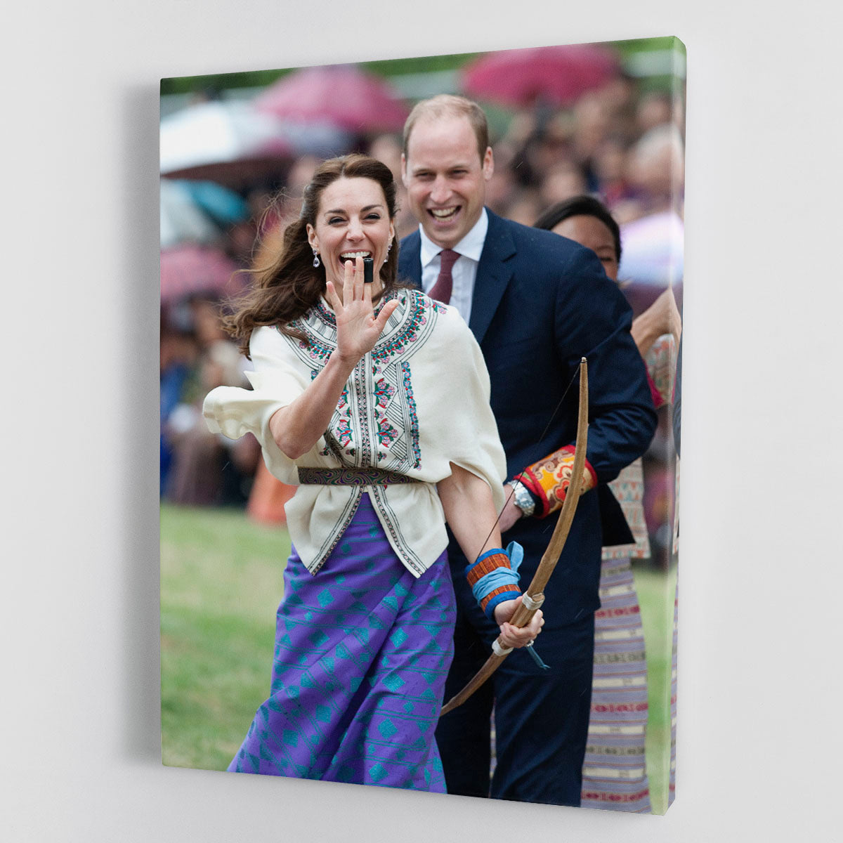 Prince William and Kate laughing trying archery in Bhutan Canvas Print or Poster - Canvas Art Rocks - 1