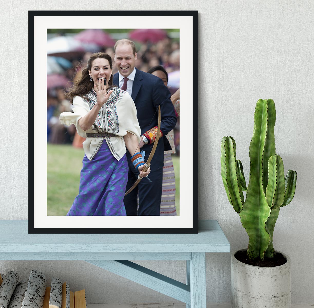 Prince William and Kate laughing trying archery in Bhutan Framed Print - Canvas Art Rocks - 1