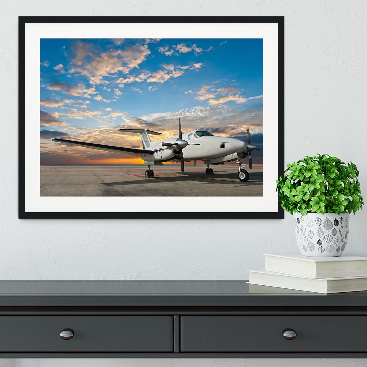 Propeller plane parking at the airport Framed Print - Canvas Art Rocks - 1