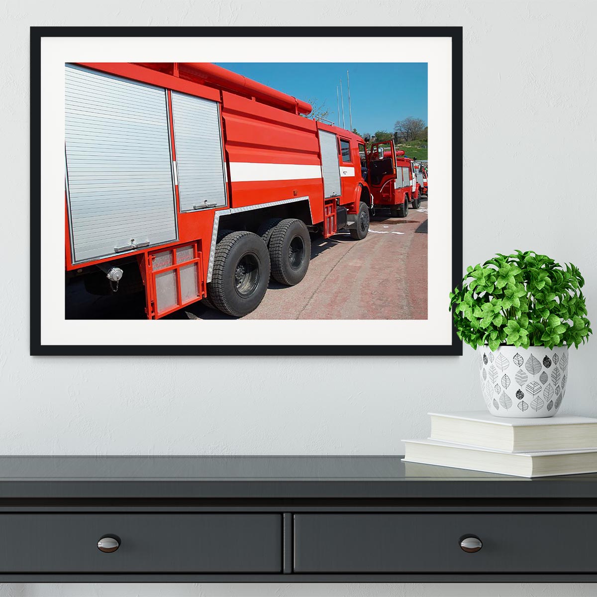Red fire engine standing on the road Framed Print - Canvas Art Rocks - 1