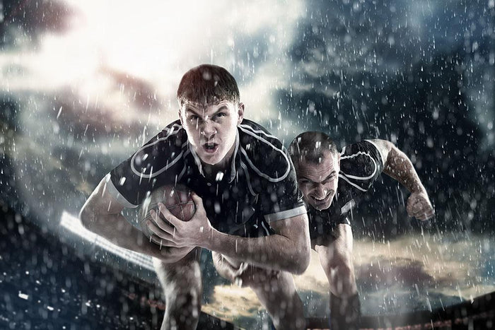 Rugby players running in the rain Wall Mural Wallpaper