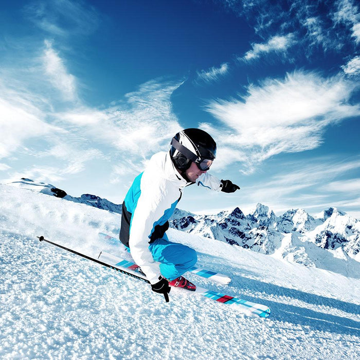 Skier in mountains Wall Mural Wallpaper