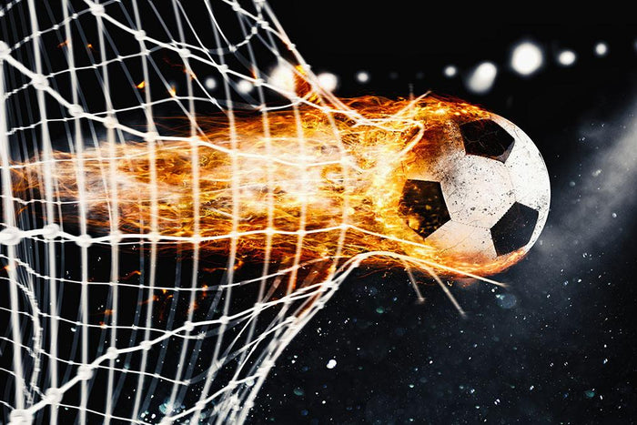 Soccer fireball scores a goal on the net Wall Mural Wallpaper