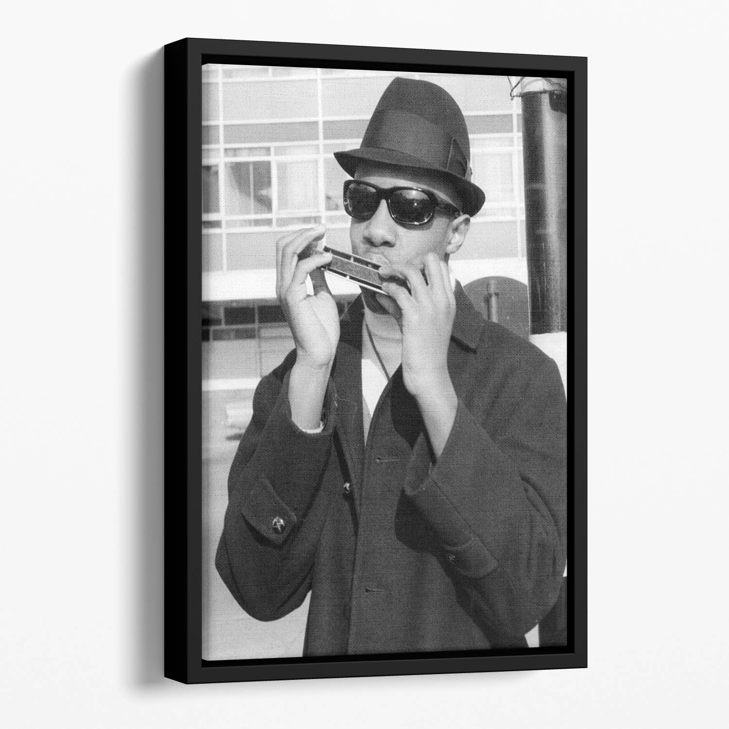 Stevie Wonder playing the harmonica Floating Framed Canvas