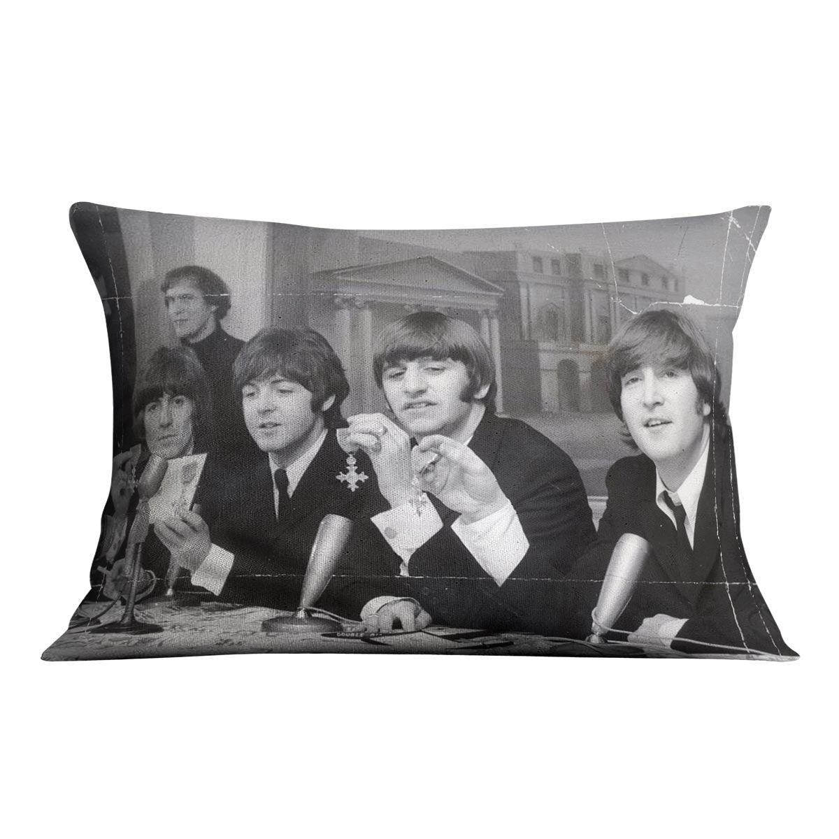 The Beatles at a press conference with their MBEs Cushion