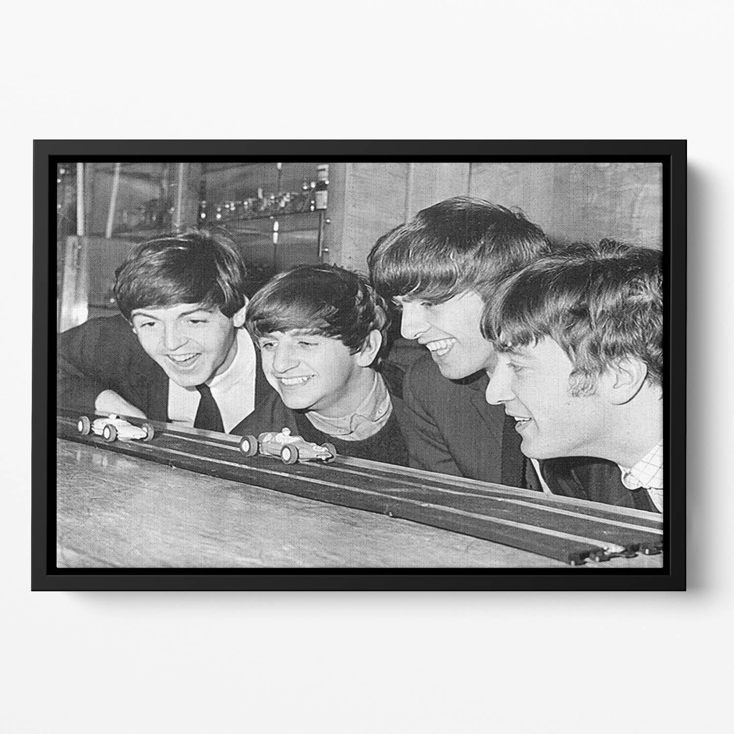 The Beatles play with toy racing cars Floating Framed Canvas