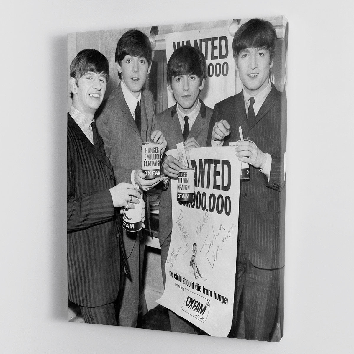 The Beatles with an Oxfam poster Canvas Print or Poster - Canvas Art Rocks - 1