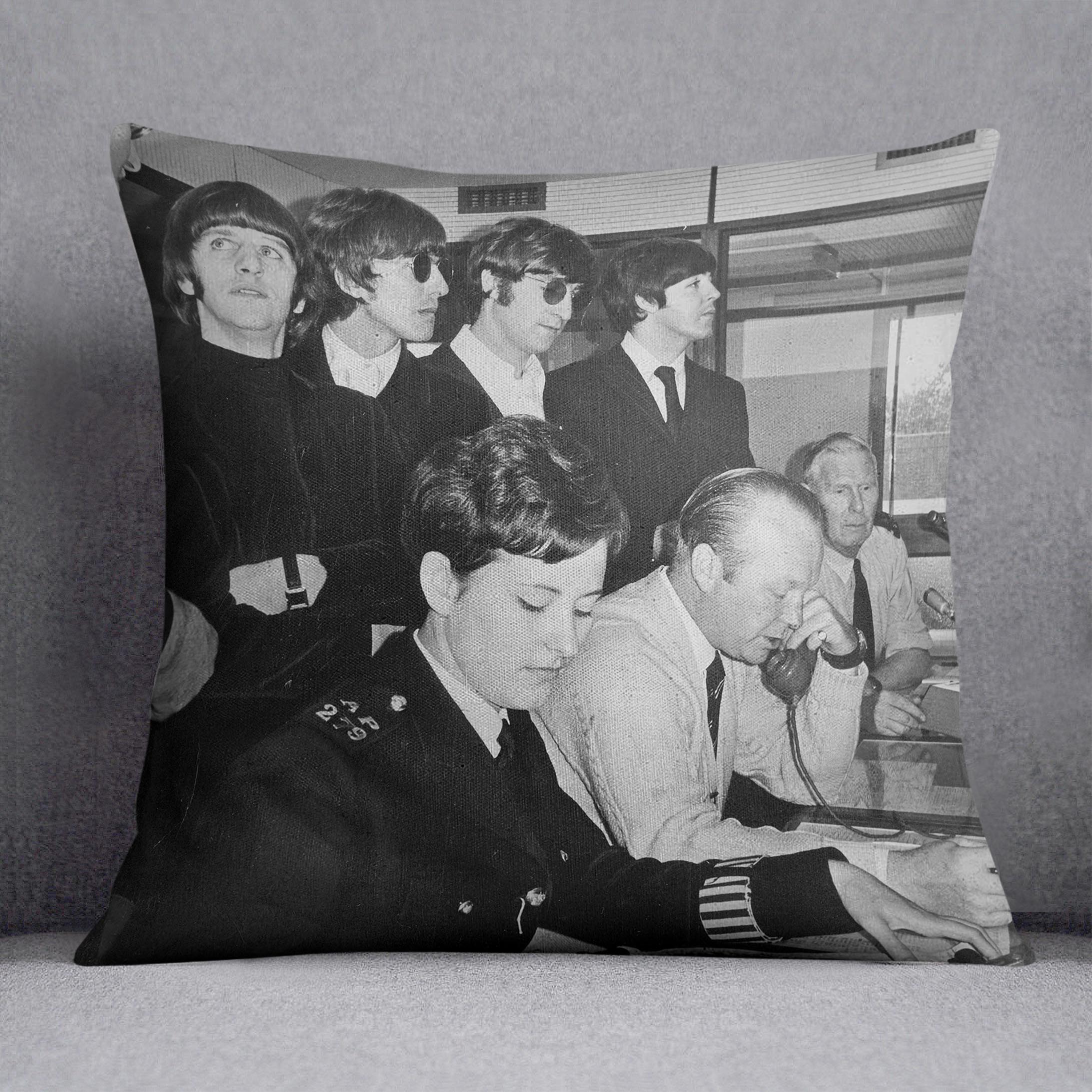 The Beatles with police at London Airport Cushion
