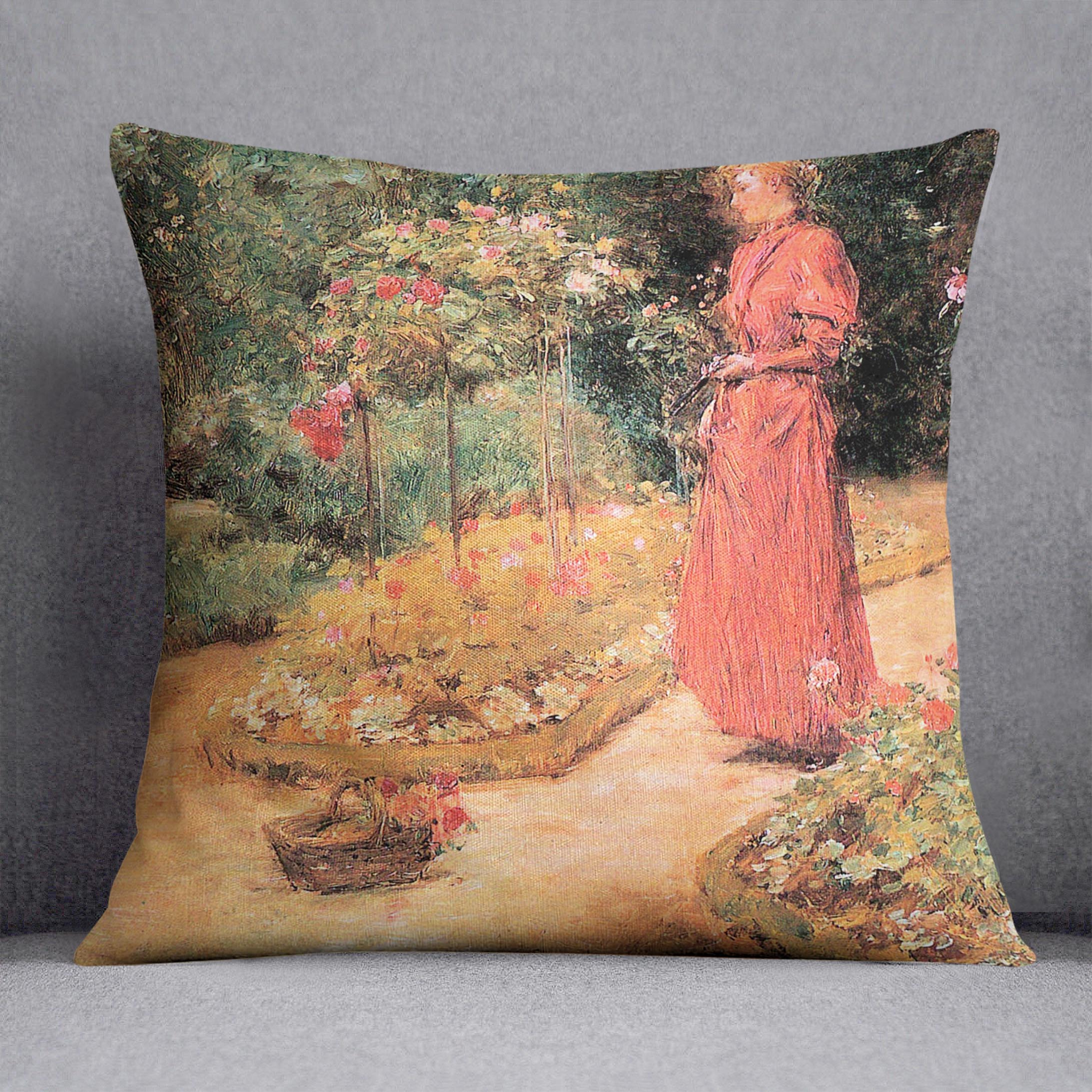 Woman cuts roses in a garden by Hassam Cushion - Canvas Art Rocks - 1