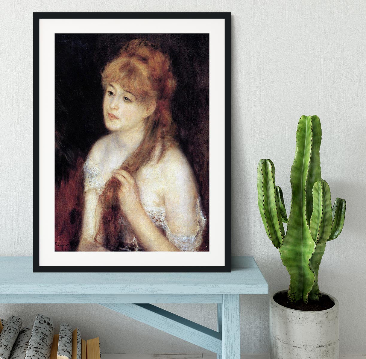 Young woman strokes her hair by Renoir Framed Print - Canvas Art Rocks - 1