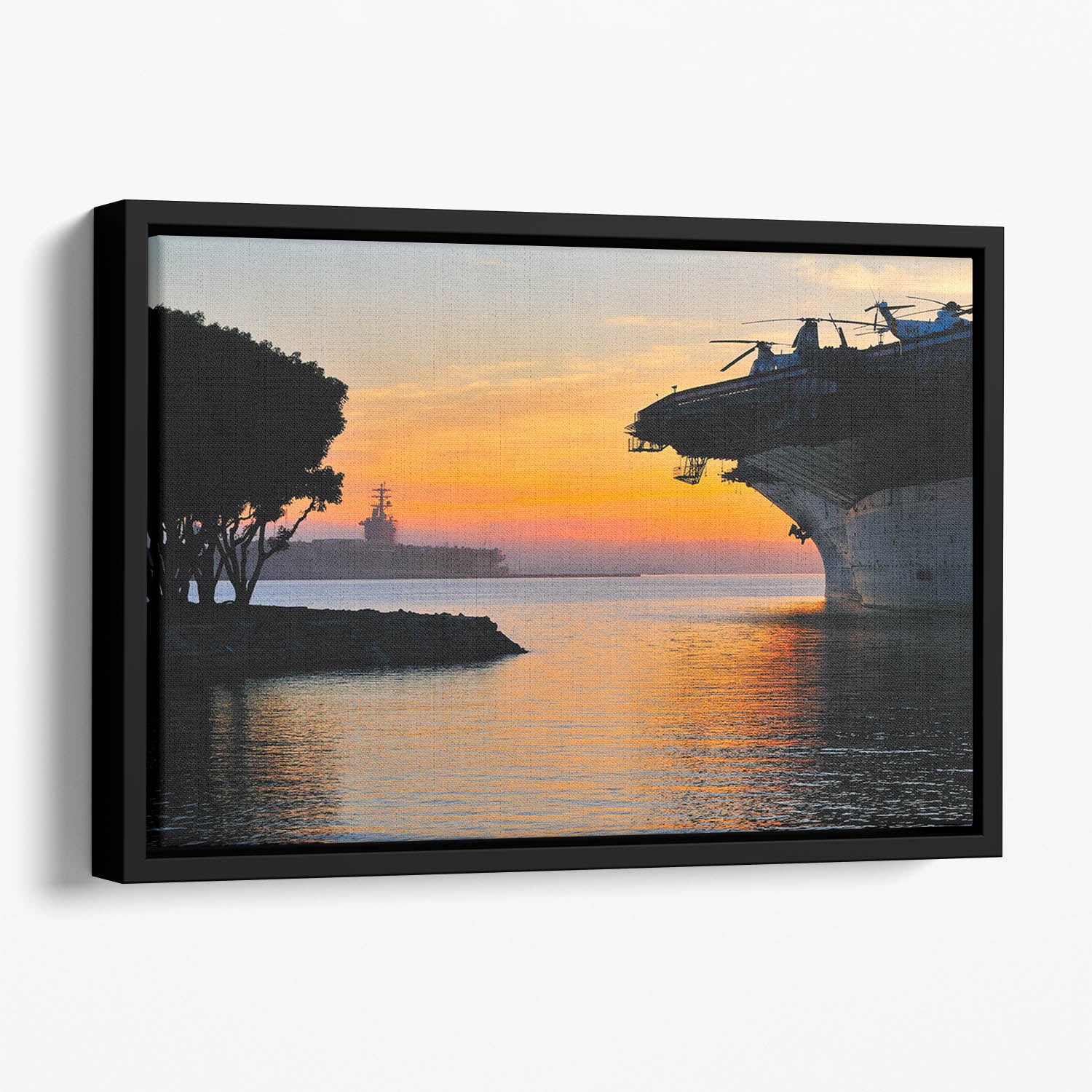 aircraft carrier in harbour in sunset Floating Framed Canvas