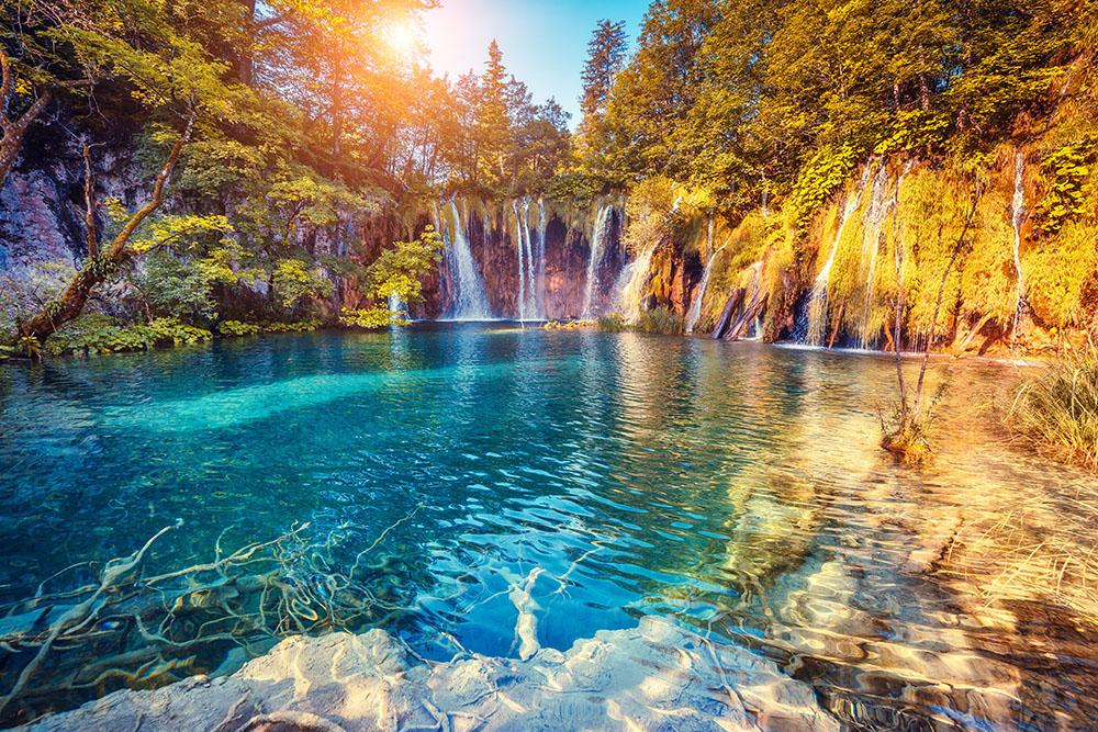turquoise water and sunny beams Wall Mural Wallpaper - Canvas Art Rocks - 1